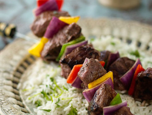 Ostrich kebabs on zesty rice