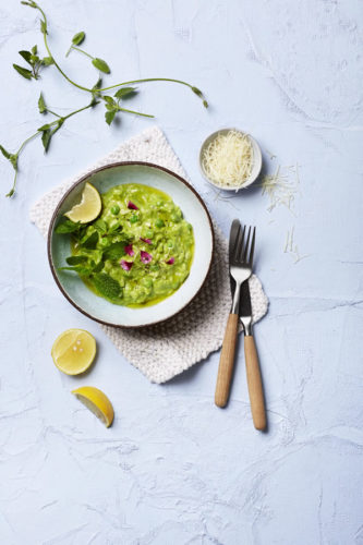 Vibrant green risotto with spinach and pea pesto